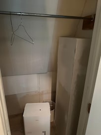 Closet 1. Unfinished and dirty.