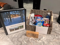 Welcome book, note, and basket of treats.