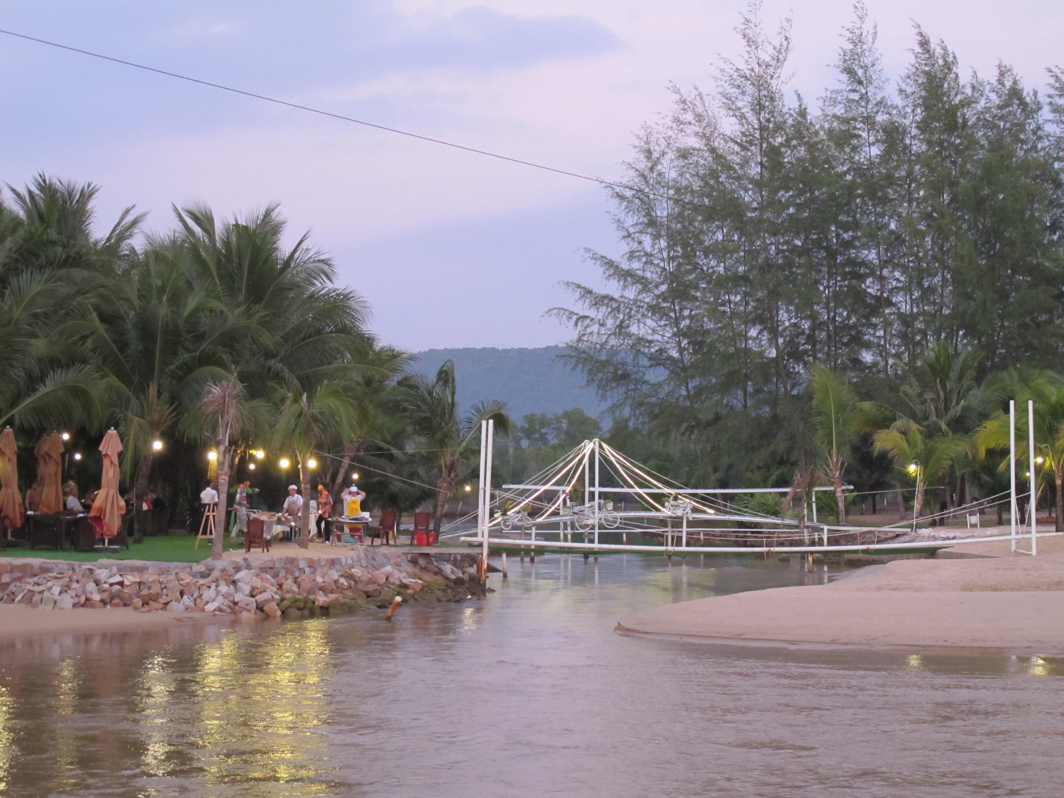 where the river meets the sea in front of the bar/restaurant area... there are three little bridges across to the main beach area