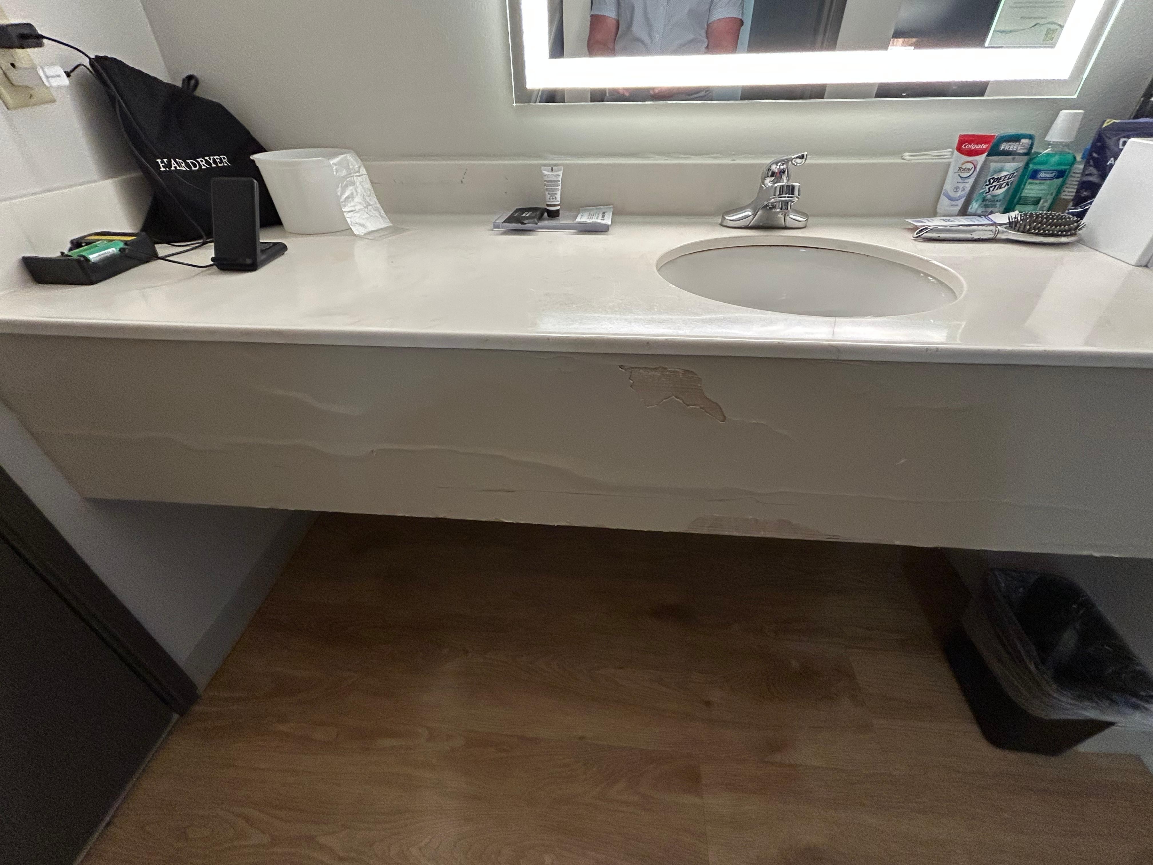 Below sing right as you walk in room. 