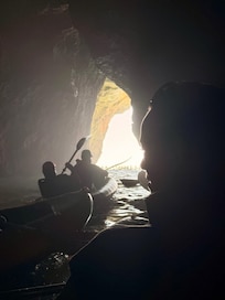 Inside one of the local caves on a kayak.