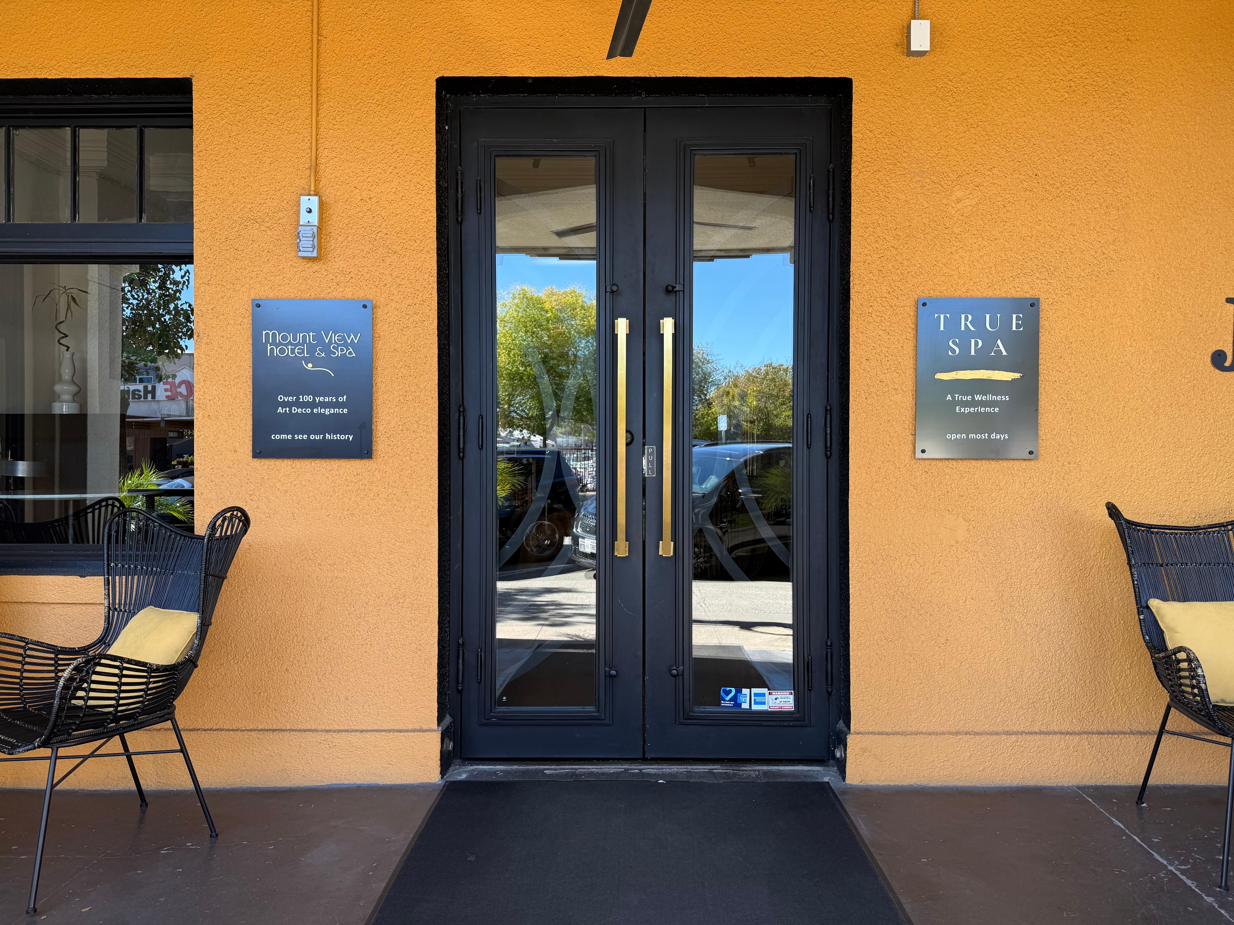 Front door with comfy seating on both sides. 