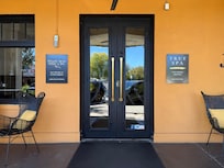 Front door with comfy seating on both sides.