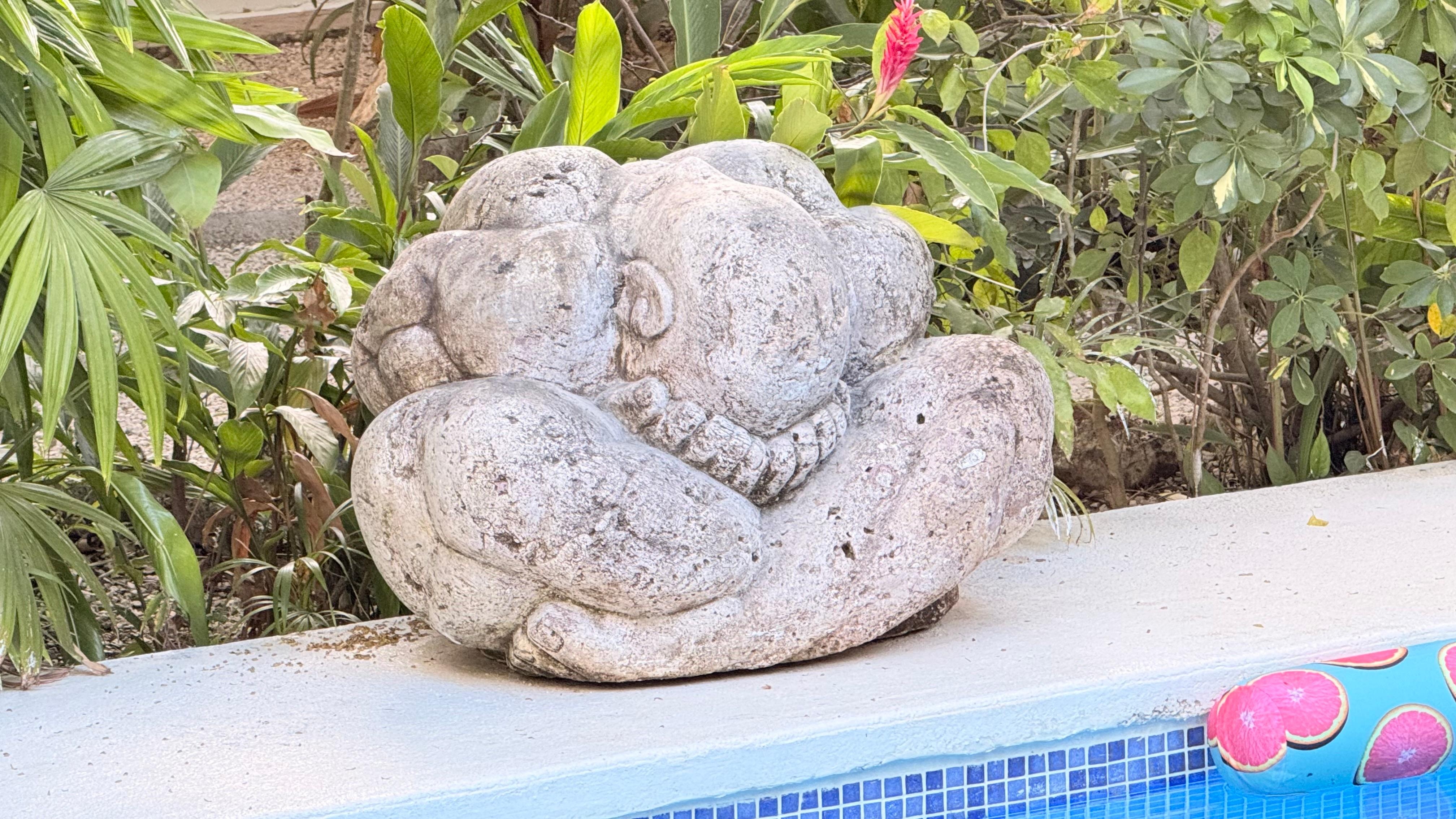 Zoom in.  Figure in lotus position, holding head in hands.  Striking. 