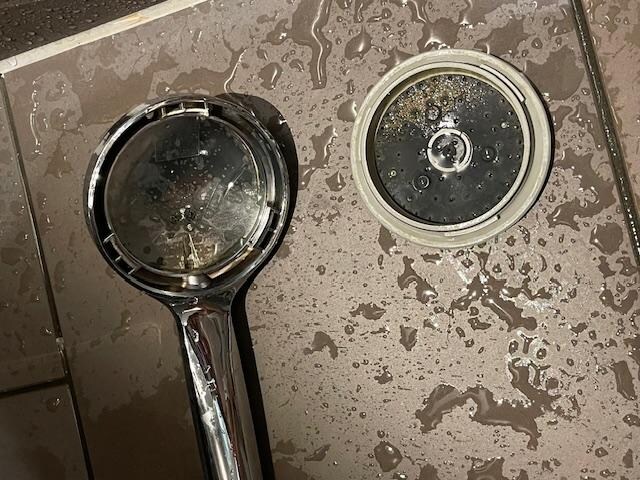 the shower dropped on the ground in the midnight