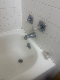 The broken shower nob for the hot water