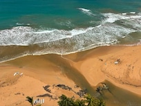 View of very quiet surfing beach below
