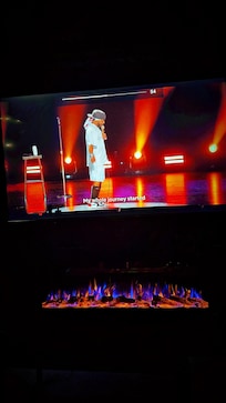 Crisp Air, Watching a show..while, Also enjoying a fireplace & Hot Tub.