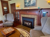 Part of living room. Lots of musical instruments