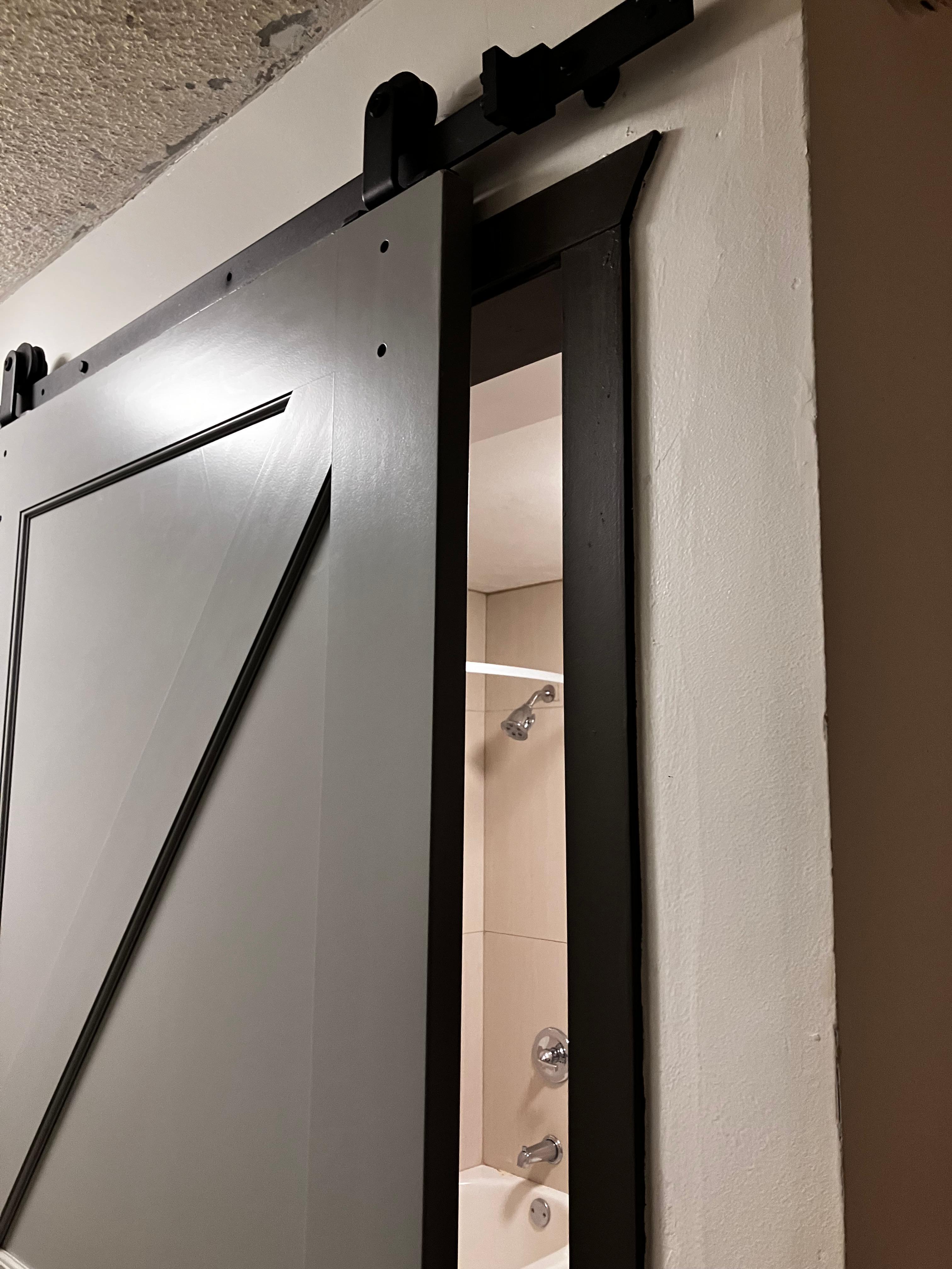 Bathroom door that would not close.  It is a barn door instead of a door with hinges.