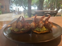 Bacon wrapped shrimp on plantain tostones