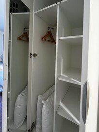 Closet with shelves. Also there was a 3-drawer cabinet