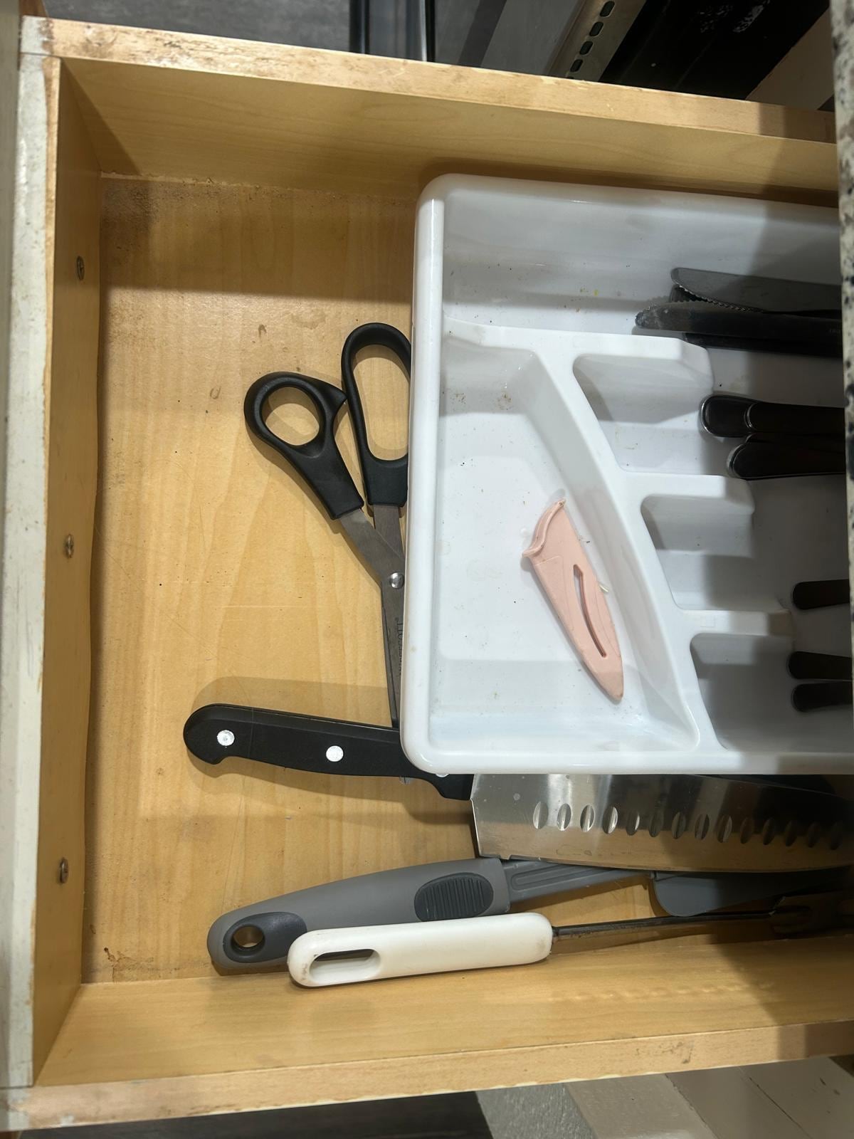 Dirty drawers and cutlery. 