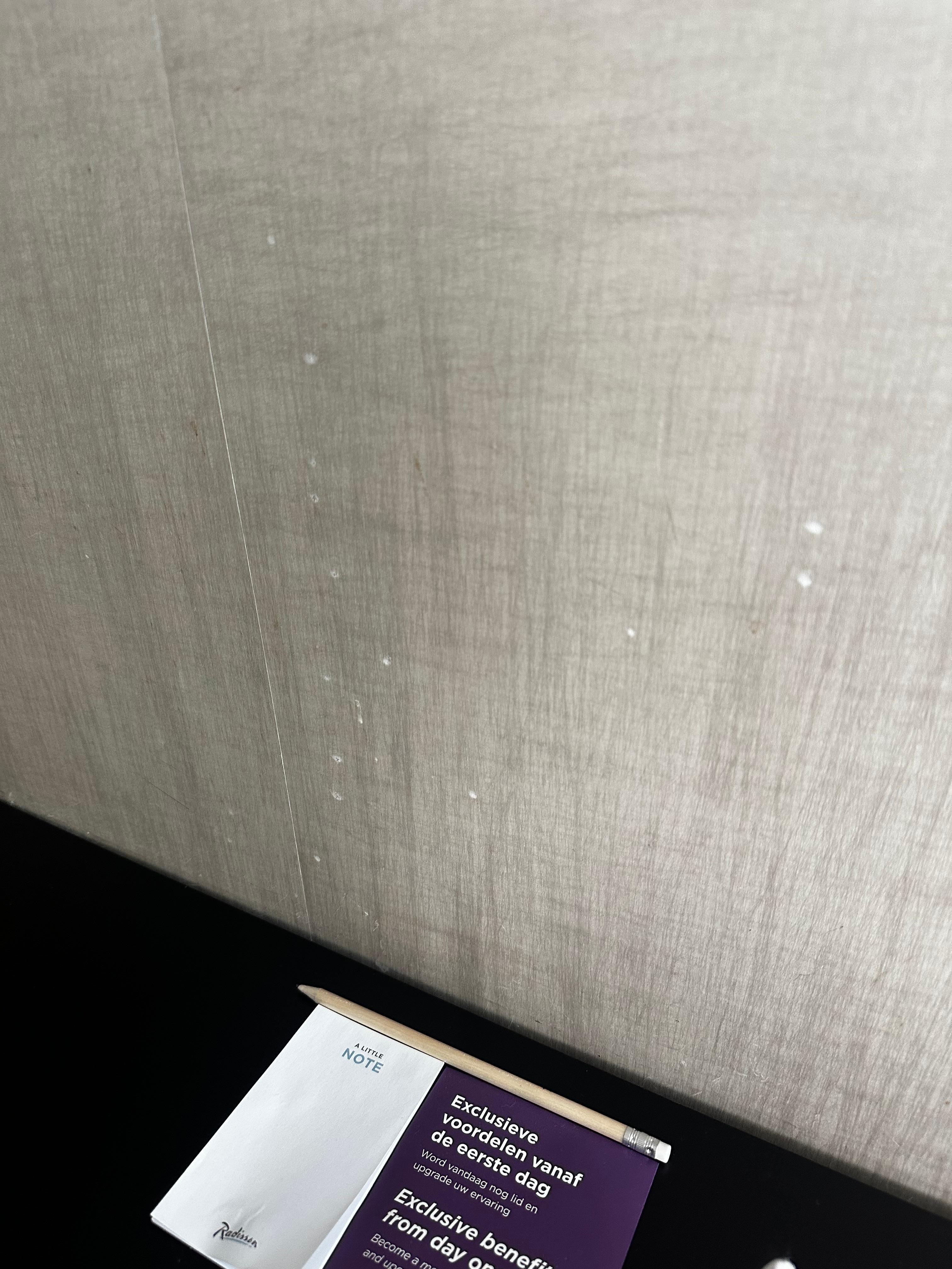 Splatter on wall beside kitchen table