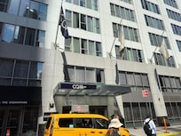 Entrance, dual identity hotels Club Quarters / World center.
