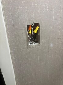 The light switch in the bathroom.