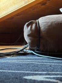 Cobwebs on loft bed.