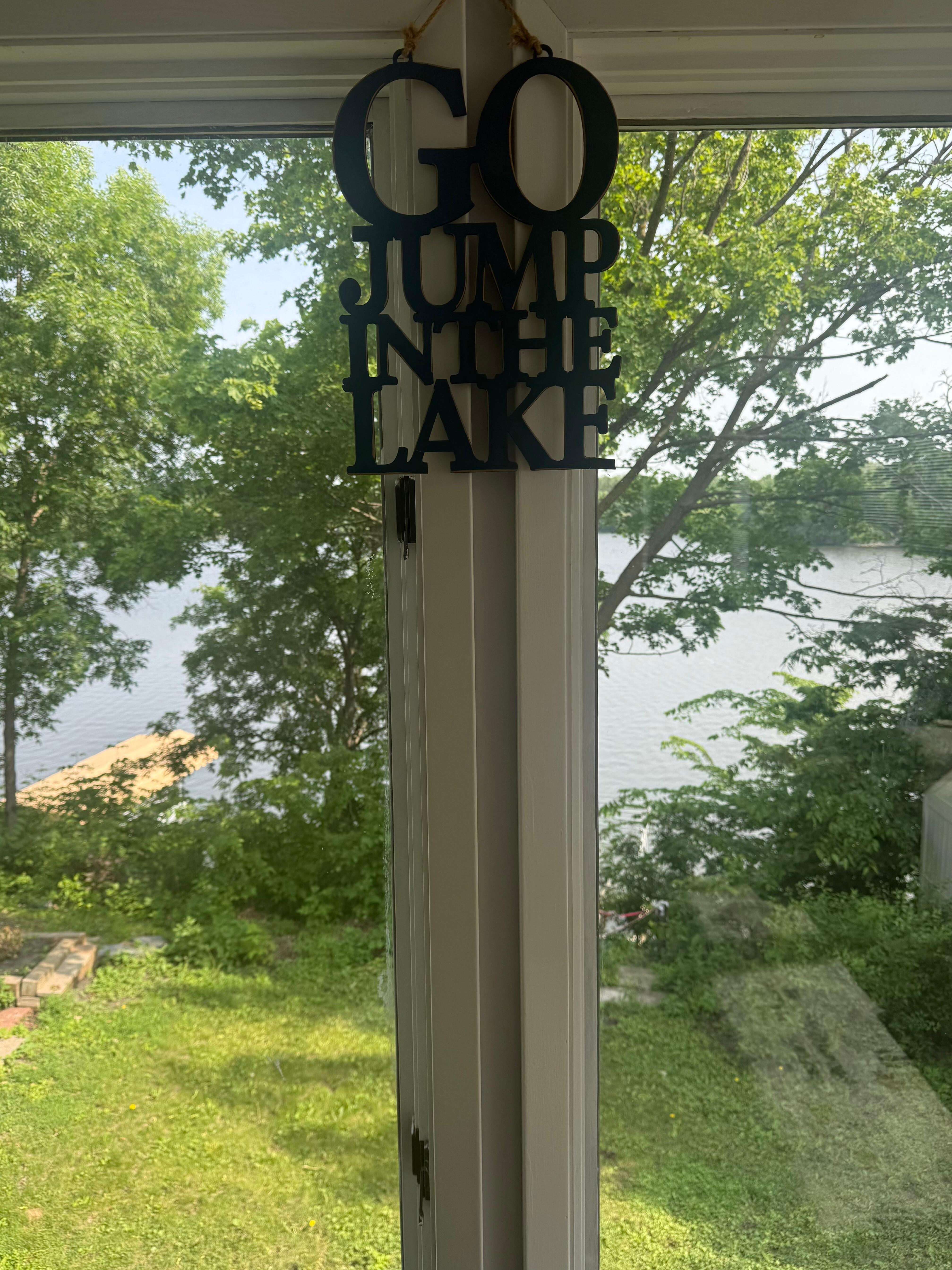 Torturous ironic sign telling us to “Go jump in the lake!” If only we could have!