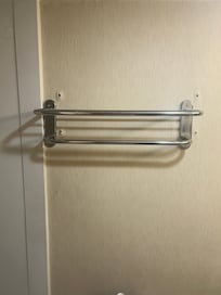 Towel rack with holes on wall