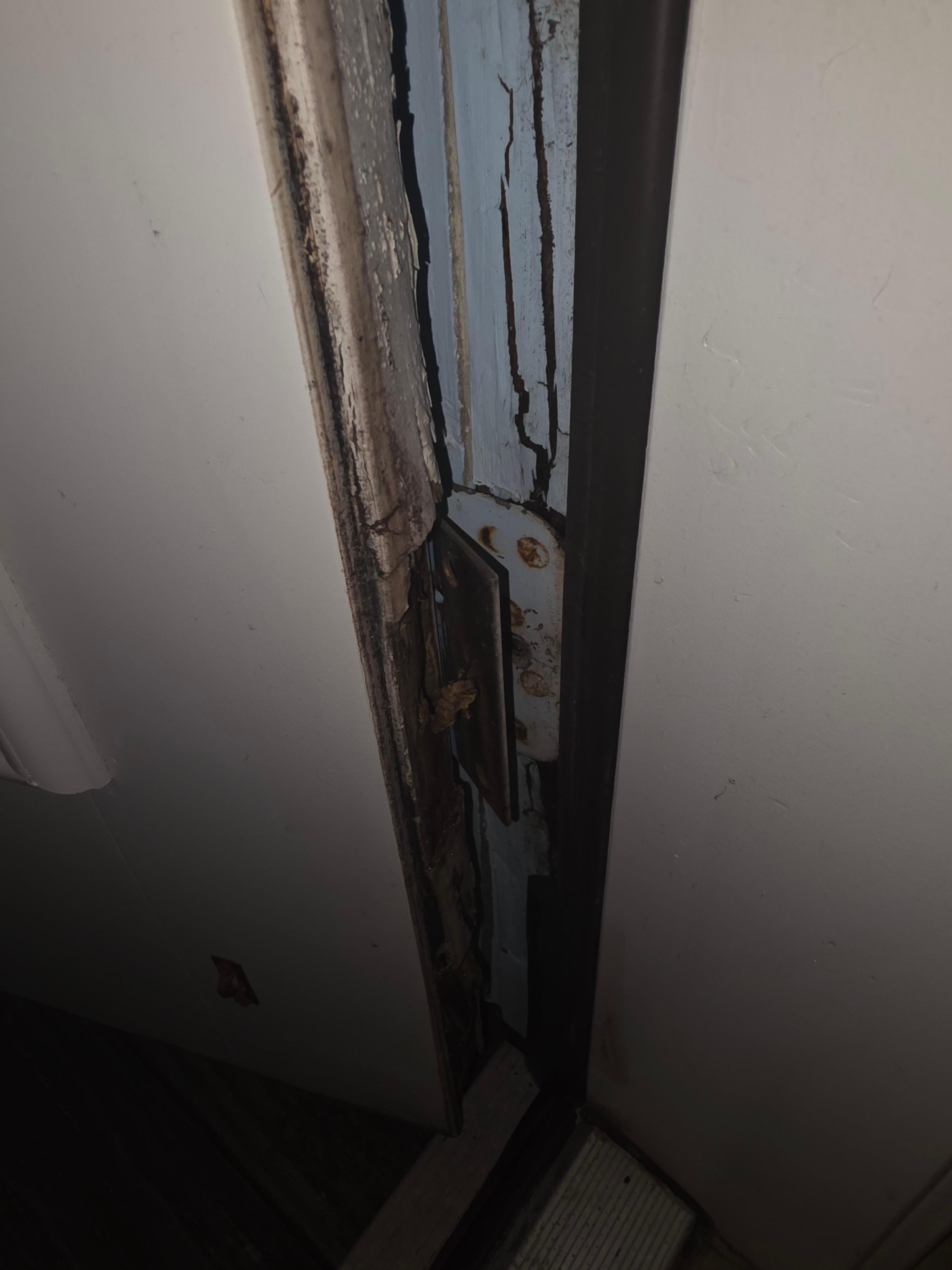 Back door at master bedroom roating at the hinges, owner sent cleaning lady out to put foam seal to stop gaps of hot air and bugs from coming in.
