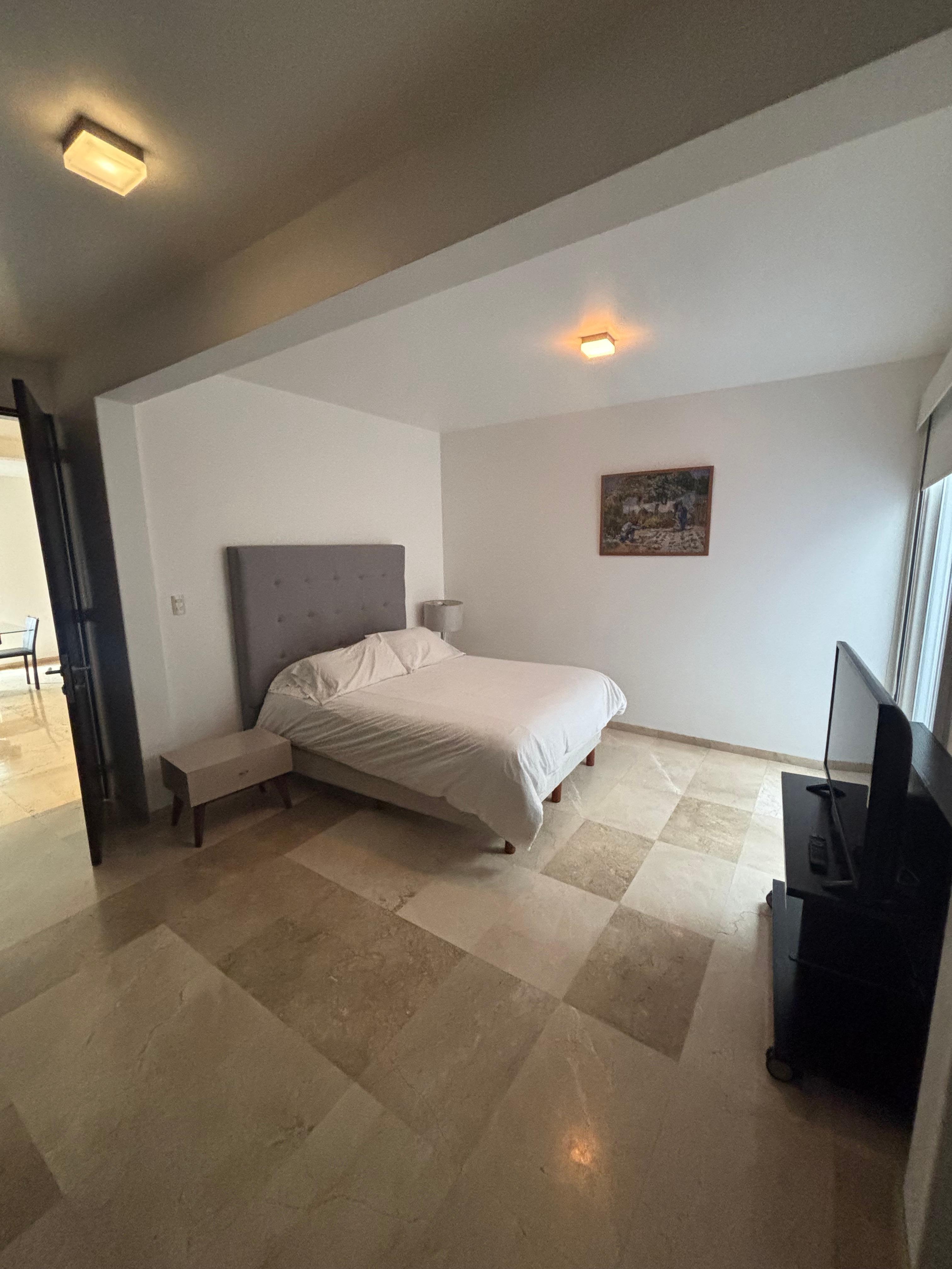 Bedroom, with sliding glass door to let air in the room.