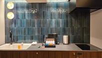 Kitchenette with fridge, sink, induction cook top, etc.