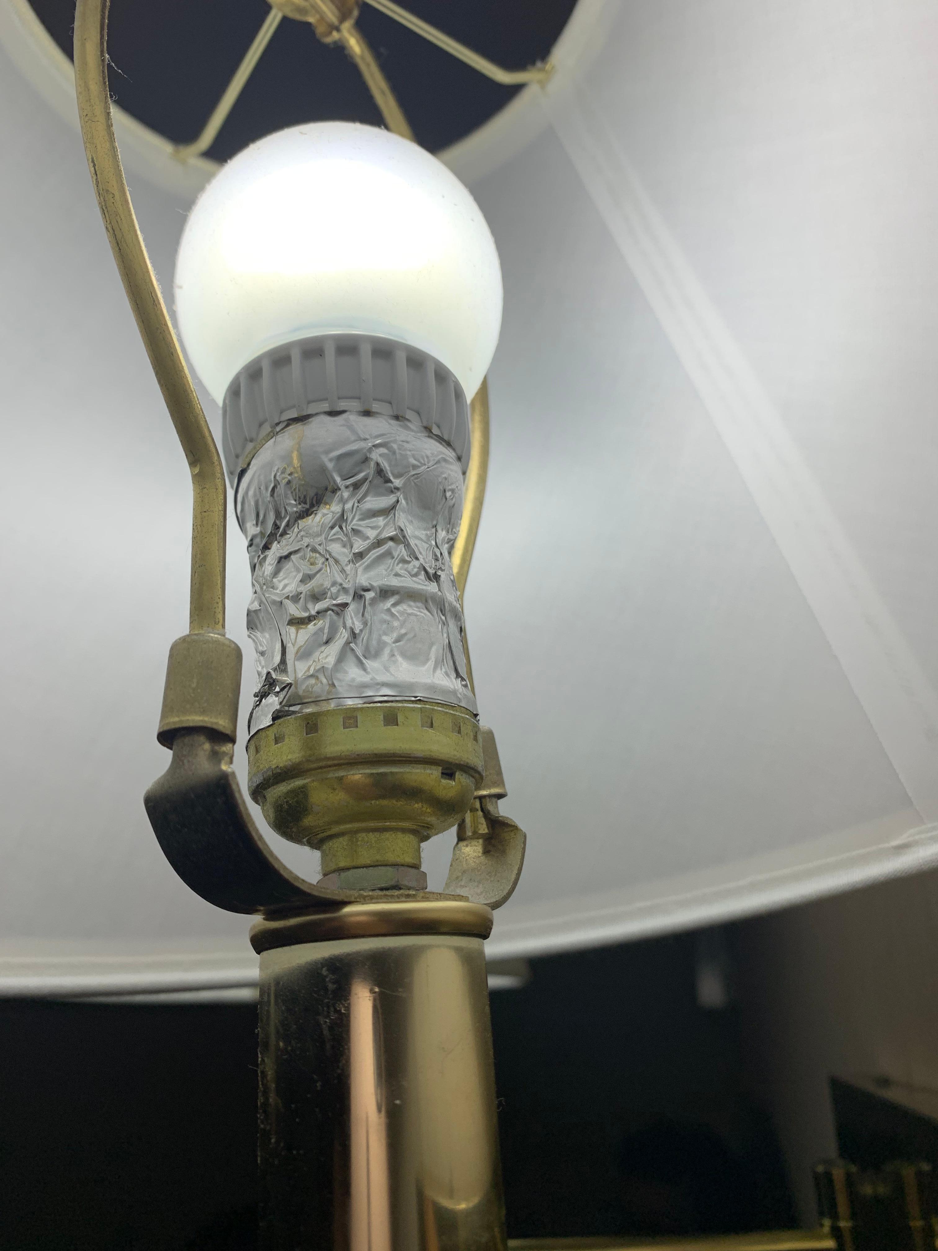 Silver tape holding lightbulbs in