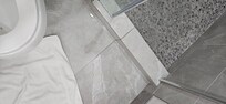 The master room shower has a water leak. The seal on the bottom of the slider has been improperly installed. There is also no seal between the fixed glass panel and the sliding door. Poor craftsmanship and uncaring owners.