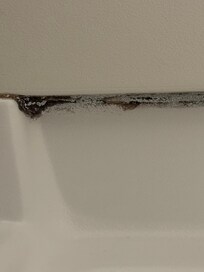 Tub needs new caulking.