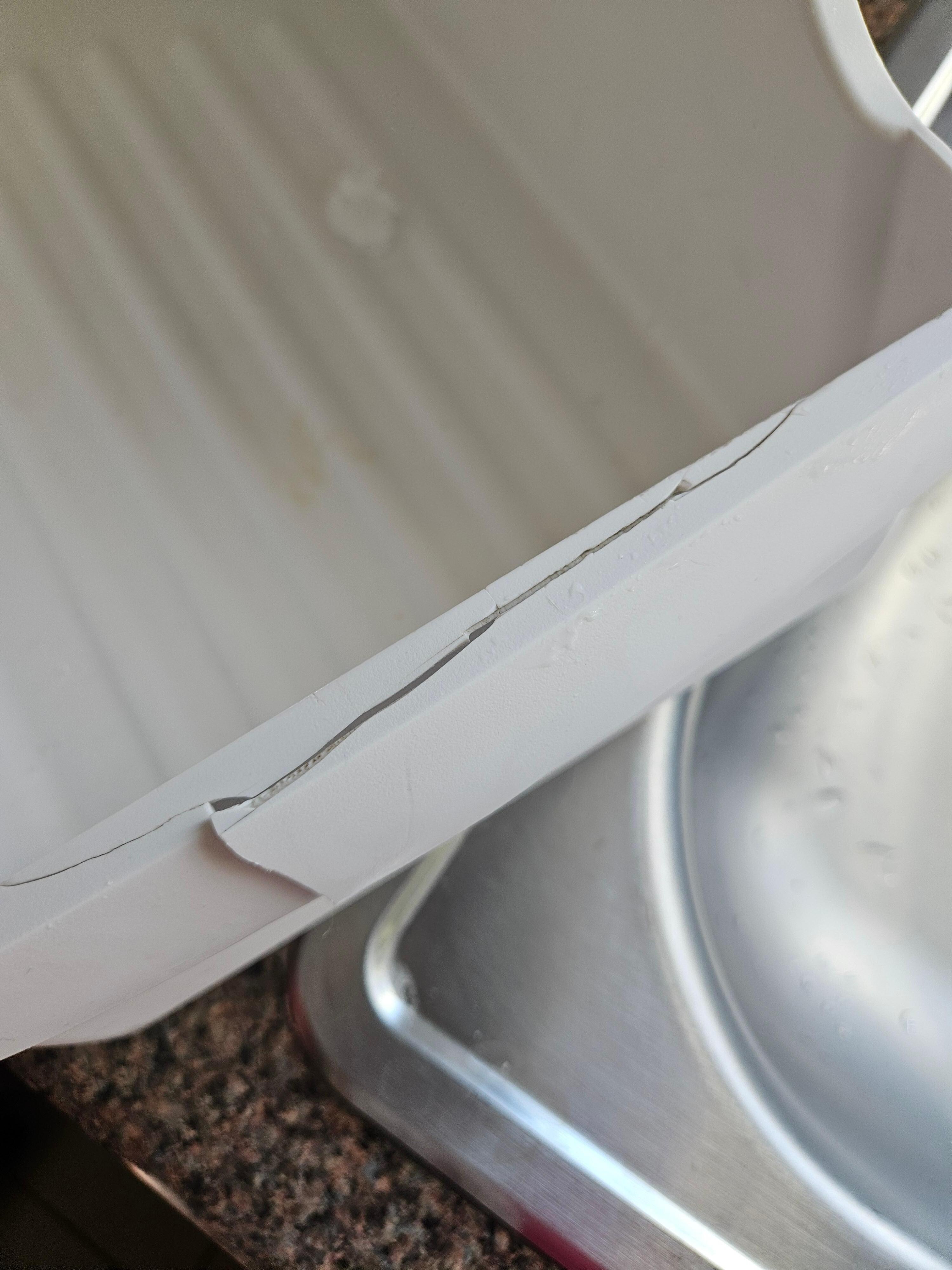 This was next to the kitchen sink. Many of the tiles throughout the kitchen and dining room are cracked, as well.