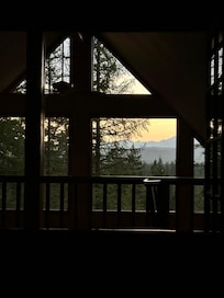 Looking out the window from upstairs bedroom at sunrise