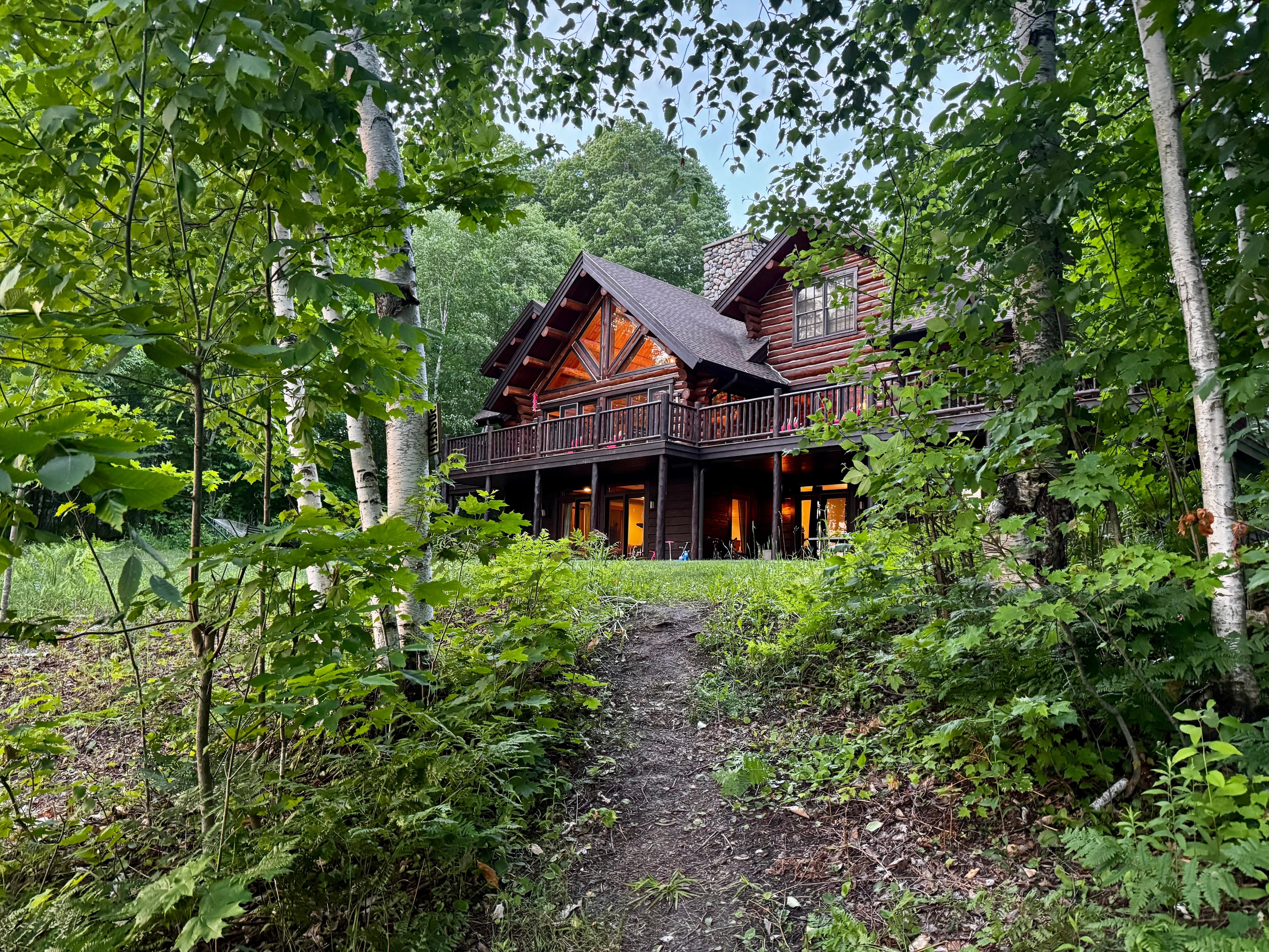 View of the house from the path to the lake.
