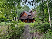 View of the house from the path to the lake.