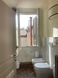 Clean toilet & bidet. Plenty of air flow from the quiet courtyard, too.
