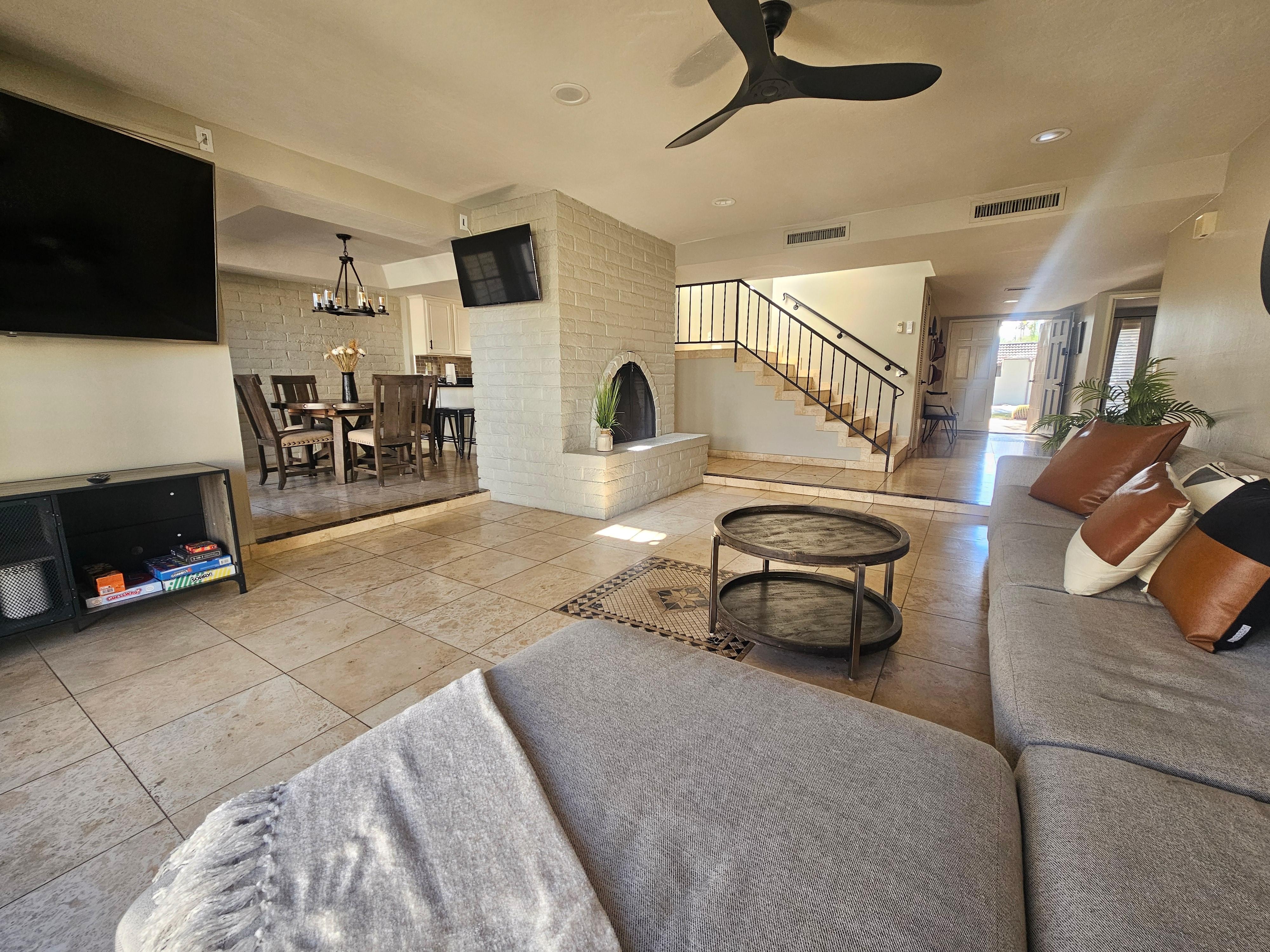 Excellent open-floor plan living room accessible to the private patio and connected to the dining and kitchen