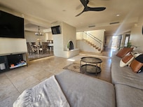 Excellent open-floor plan living room accessible to the private patio and connected to the dining and kitchen