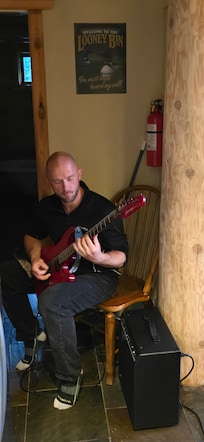 Chillin playing some amazing guitar.