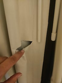 Tears in curtains.