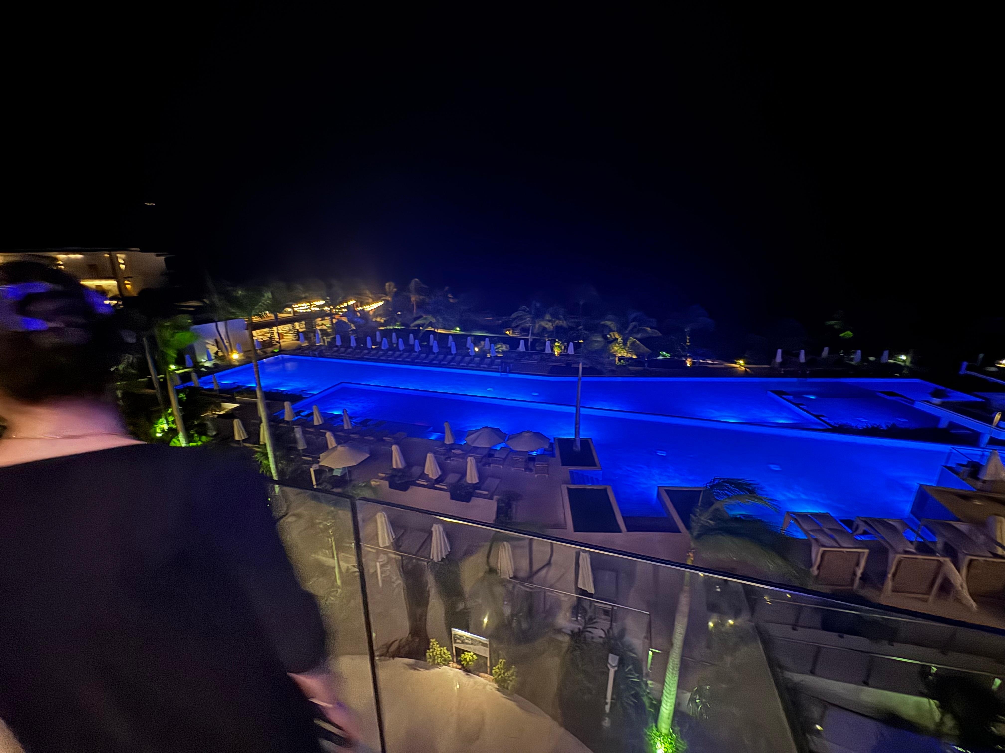 Main pool at night from the lobby area