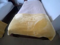 Random handprints on the bed. Looks like kids were playing - how long since this was cleaned?