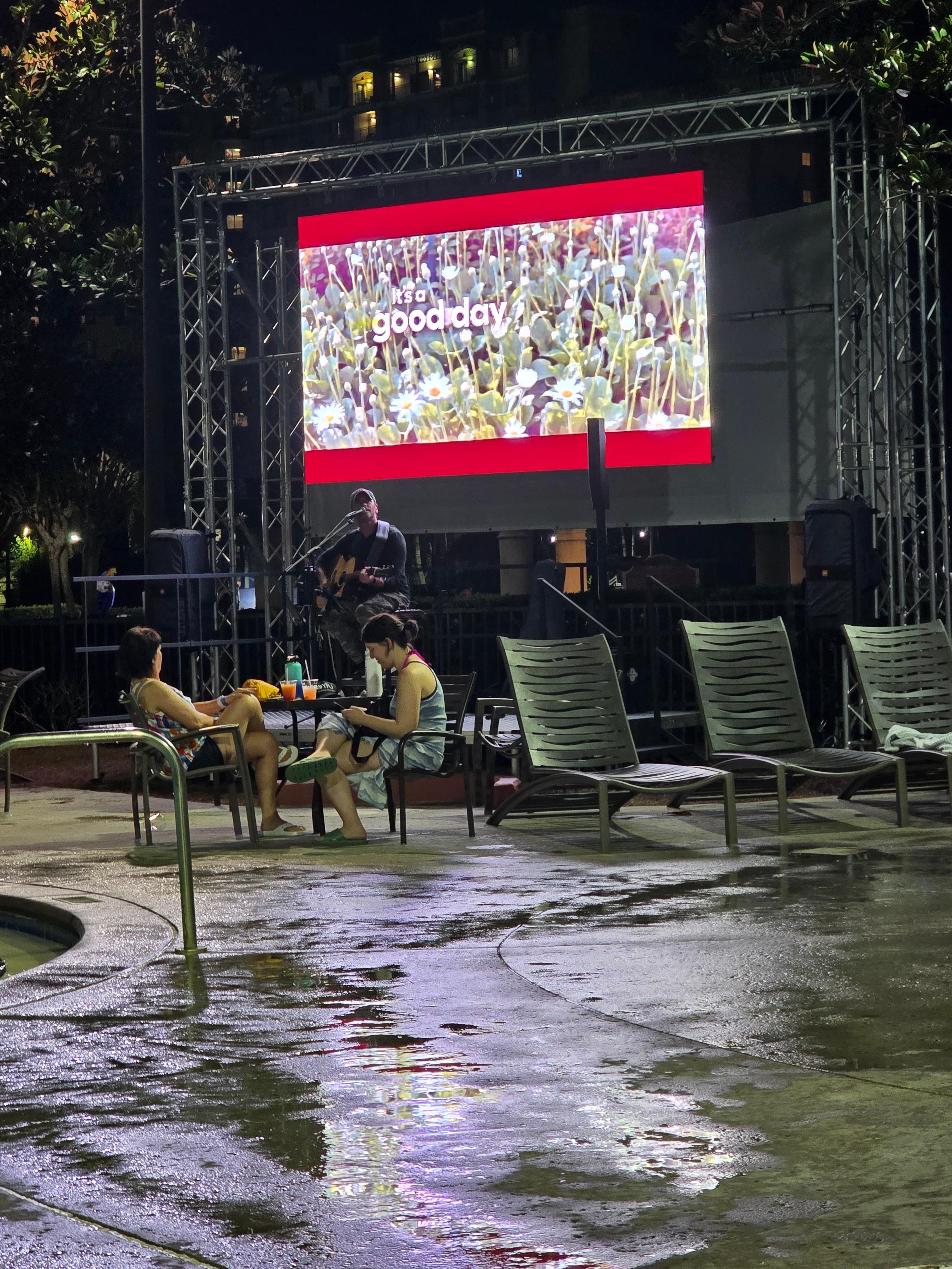 Poolside big screen with sports and this night, live music.  Pizza available here also.