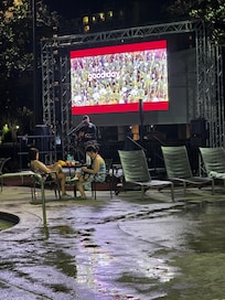 Poolside big screen with sports and this night, live music. Pizza available here also.
