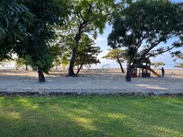 The close proximity to the private beach for guests and the chairs also included in accompdation