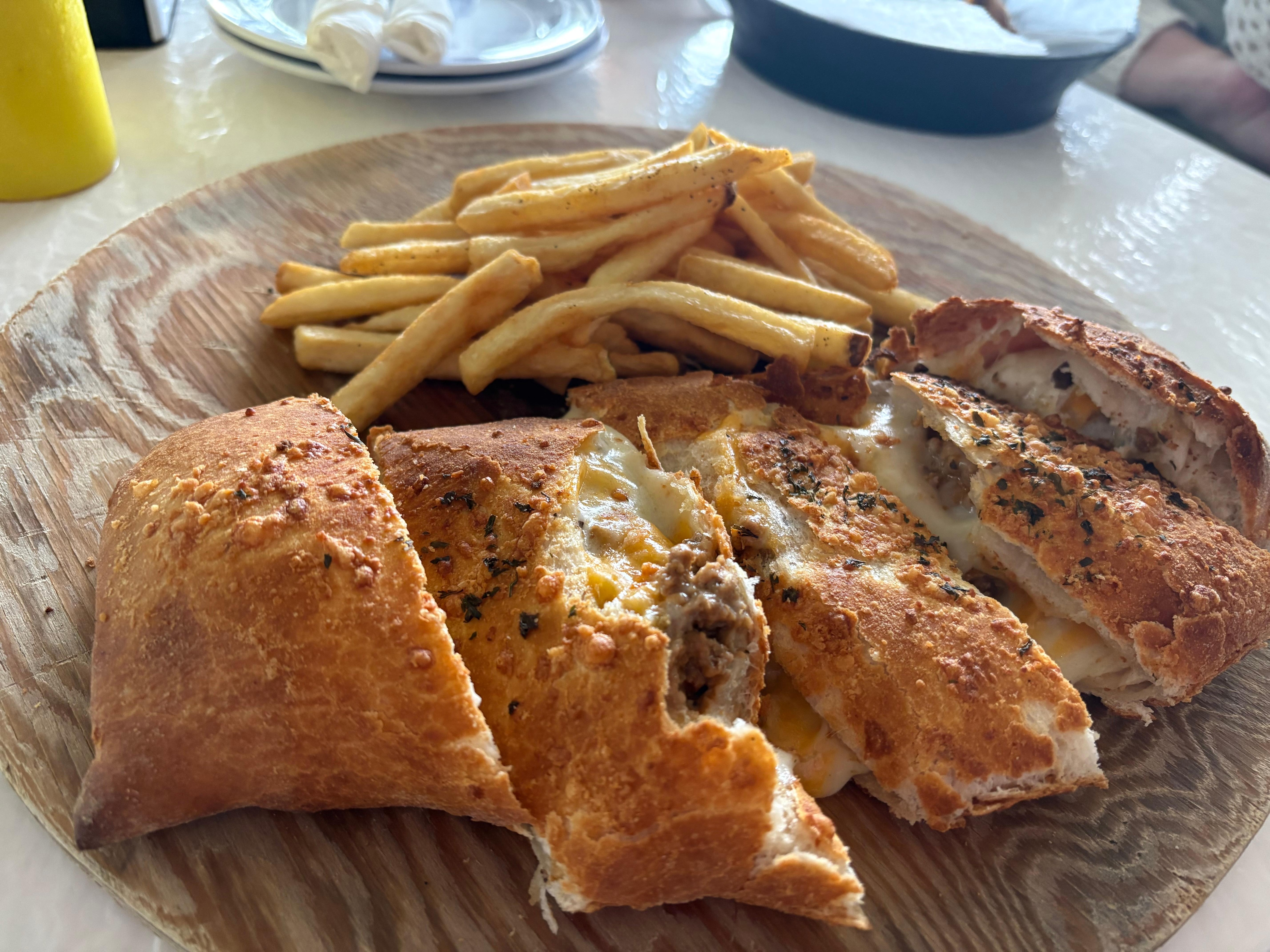 Some of the food the restaurant serves, Cheeseburger Strombolis
