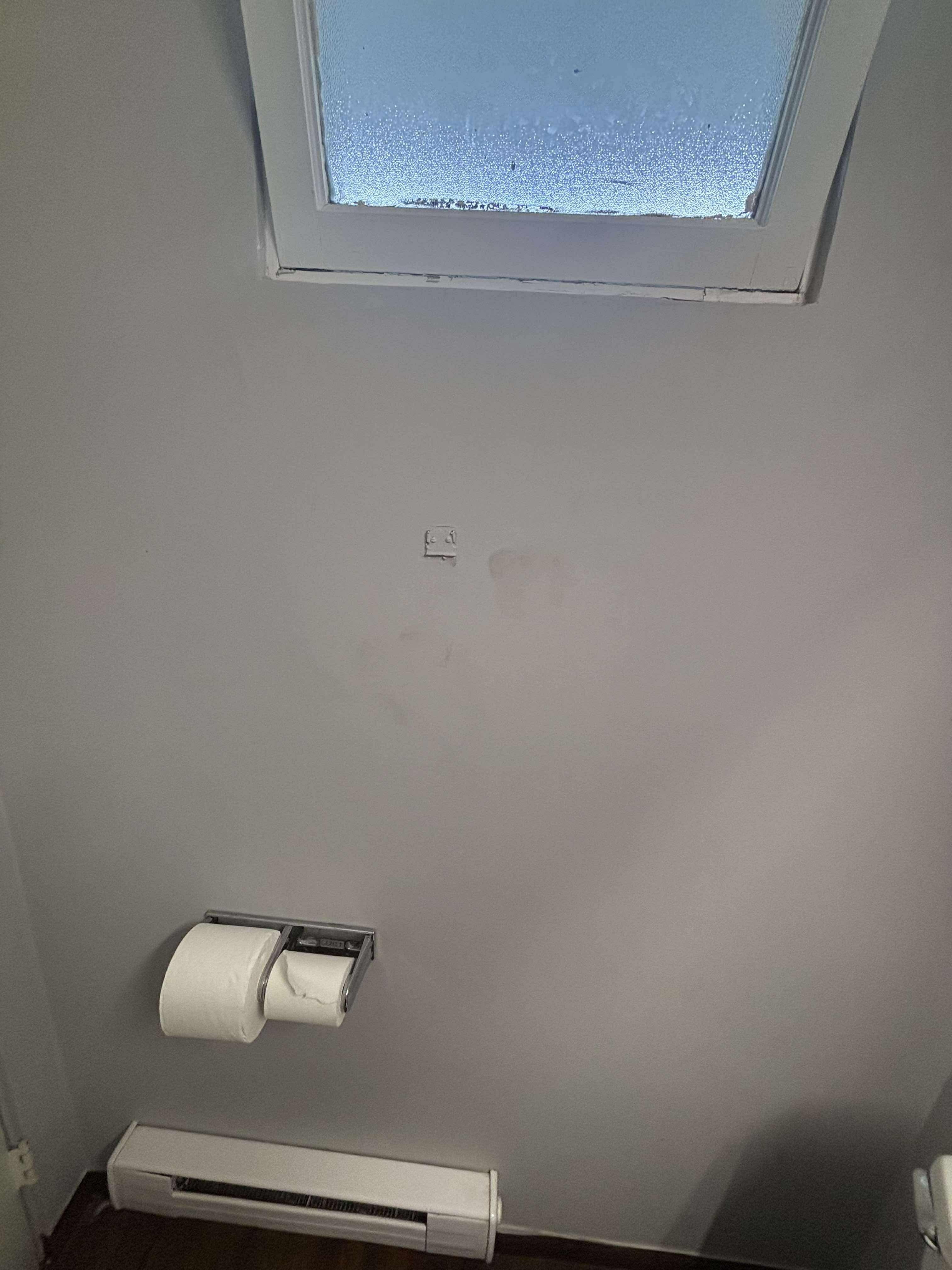 Hand prints on wall