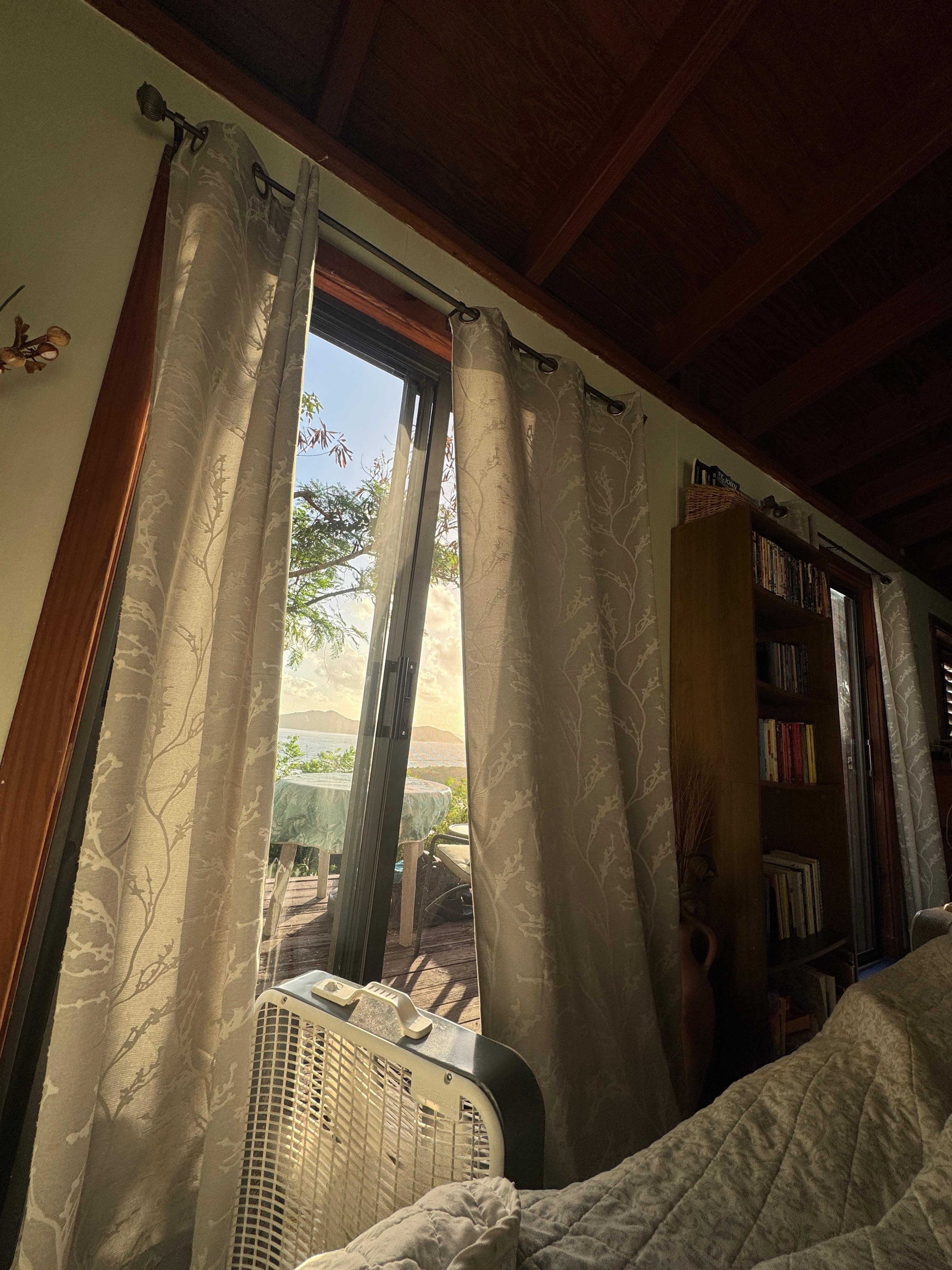 View from the bed however can have a full view with curtains open. 