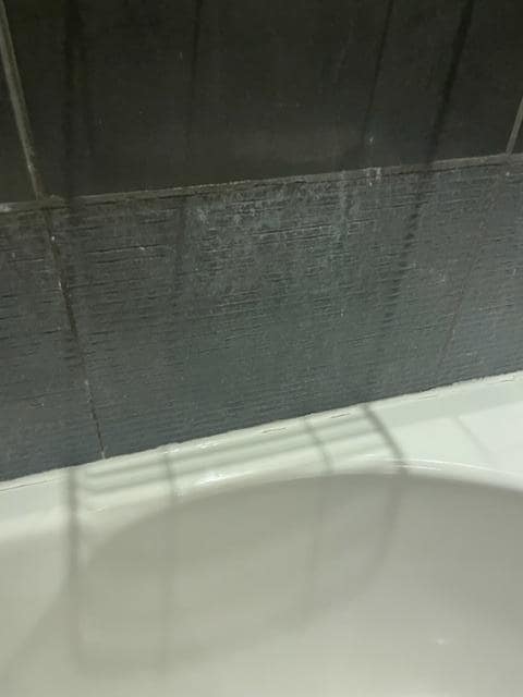 No tiles on the wall in the bathroom