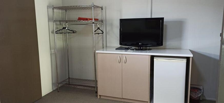 All furniture in room except bed, bedsides and table and 2 chairs