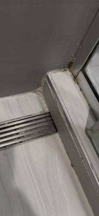 Condition of shower upon arrival. Multiple hairs in shower. Not pictured was missing grout on shower floor.