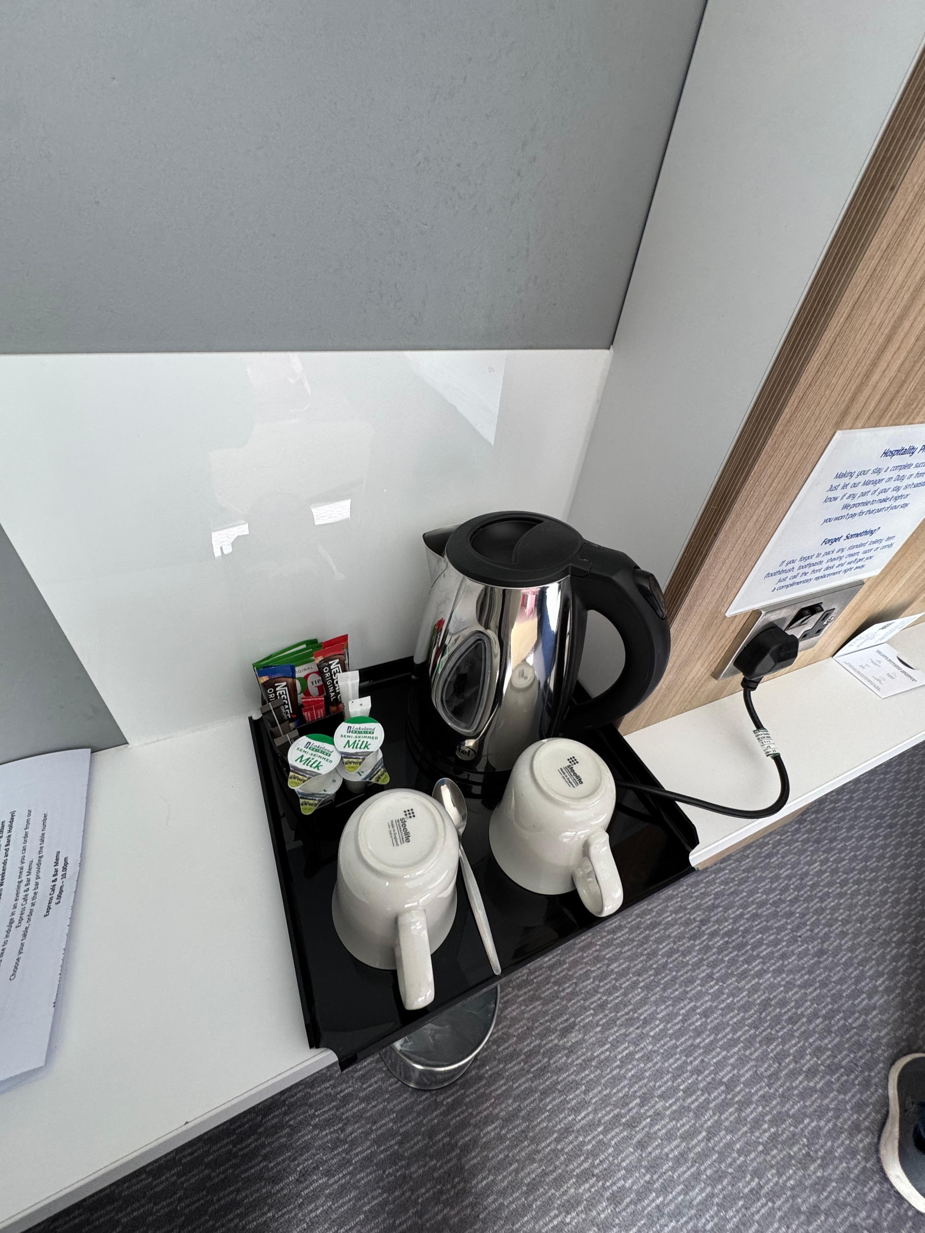 Kettle and some stuff to drink in the room